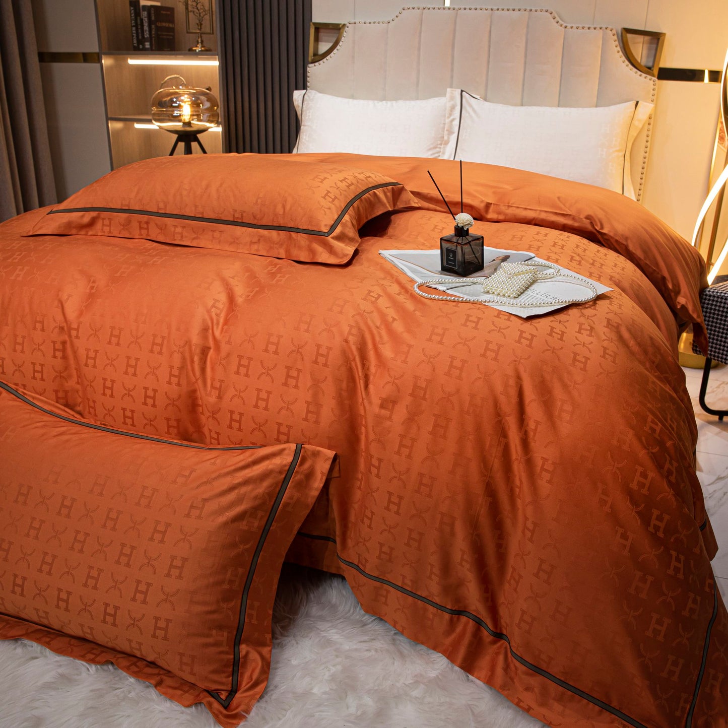 Luxurious tangerine sateen bedding set made from soft, breathable Tencel cotton with subtle textured pattern.