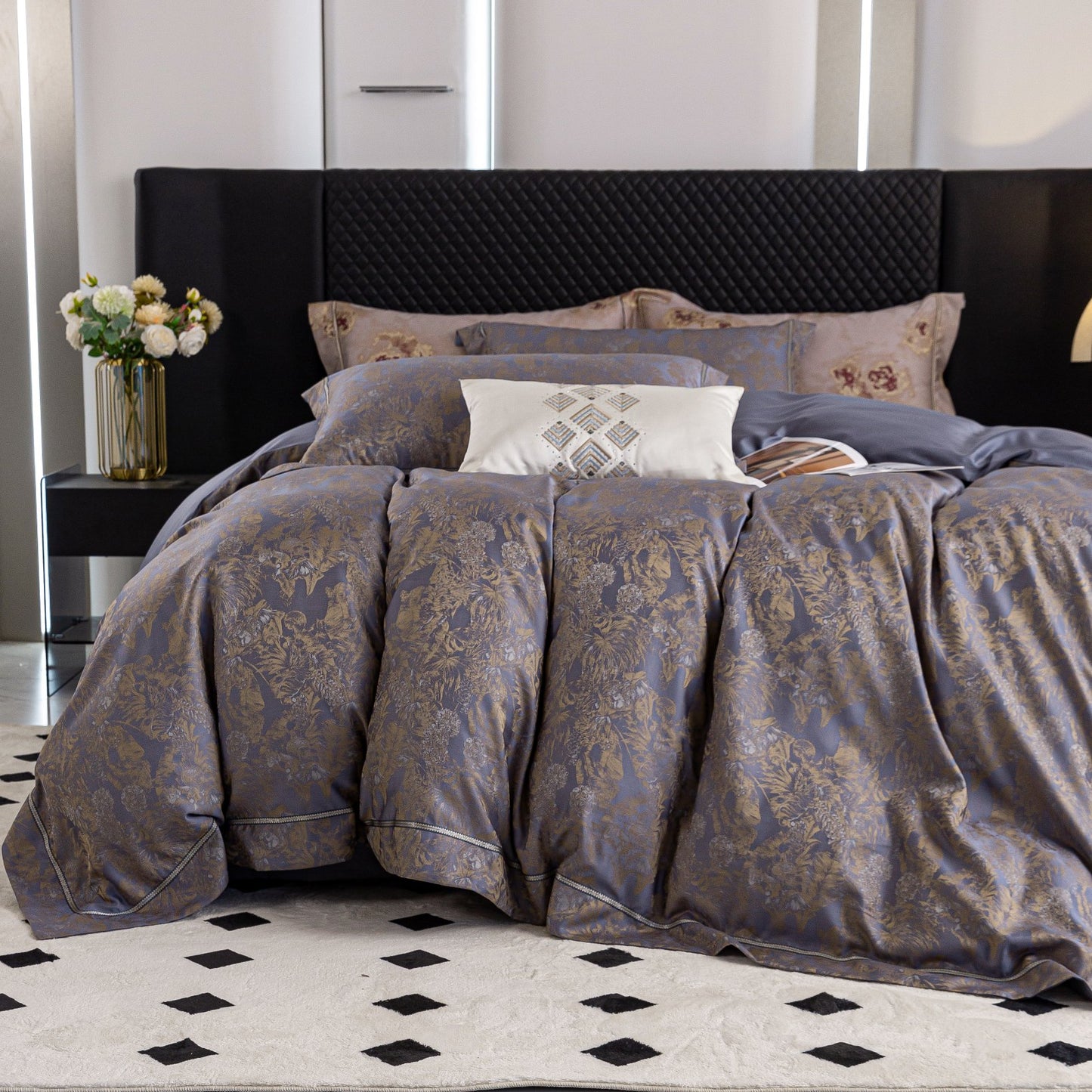 Luxurious Versailles sateen bedding set in elegant muted tones with intricate floral patterns on a king-size bed