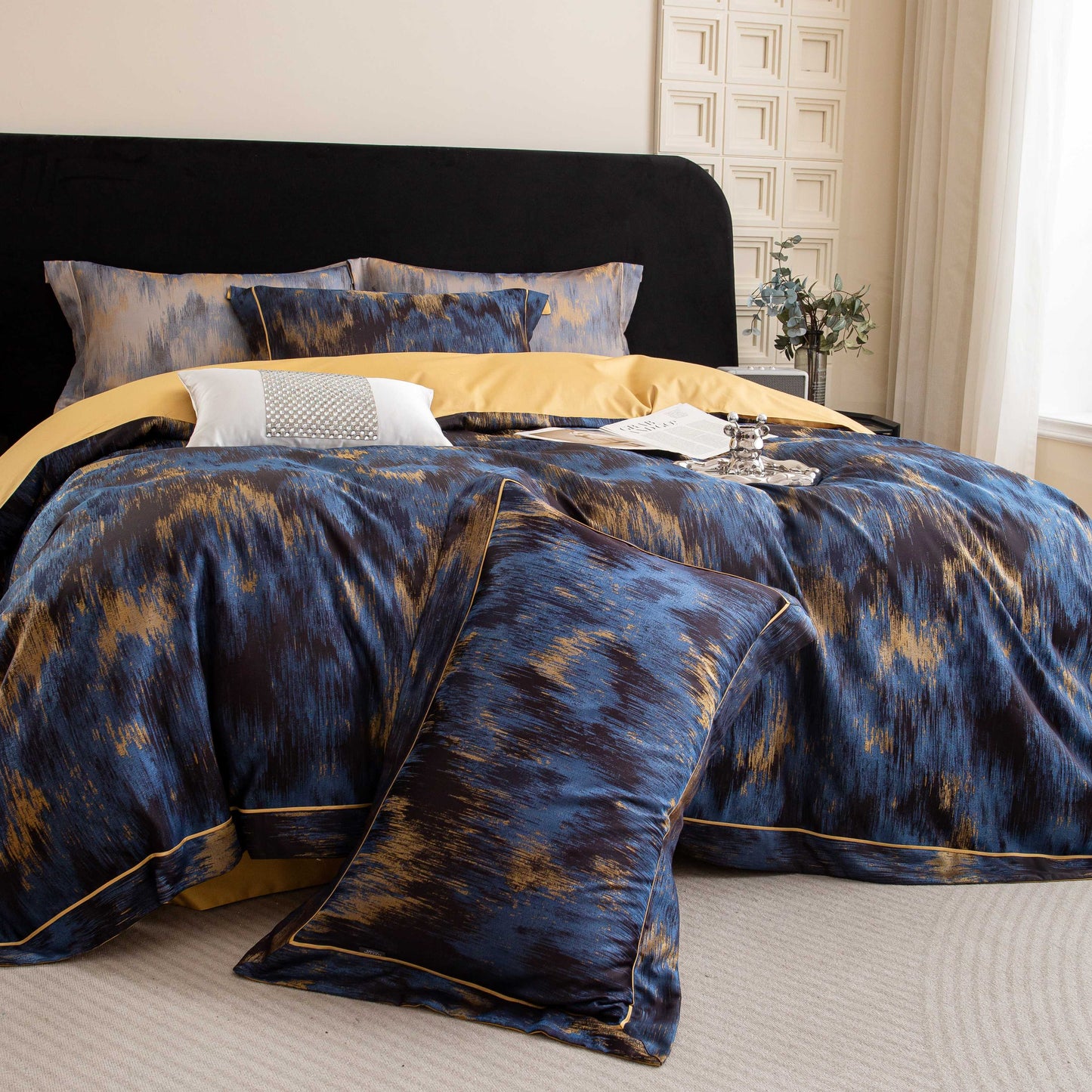 Luxurious Marrakech sateen bedding set in blue and gold tones made from soft, breathable Tencel cotton for elegant comfort.