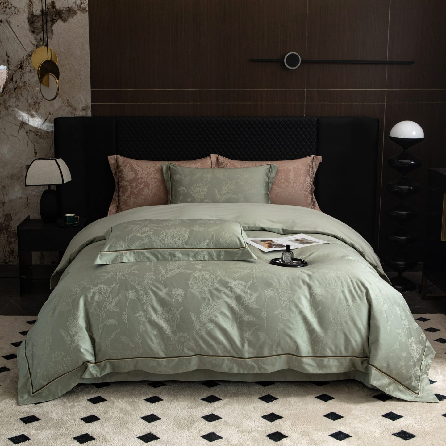 Luxurious Avignon sateen bedding set in soft green and blush tones with elegant floral pattern on king-size bed.