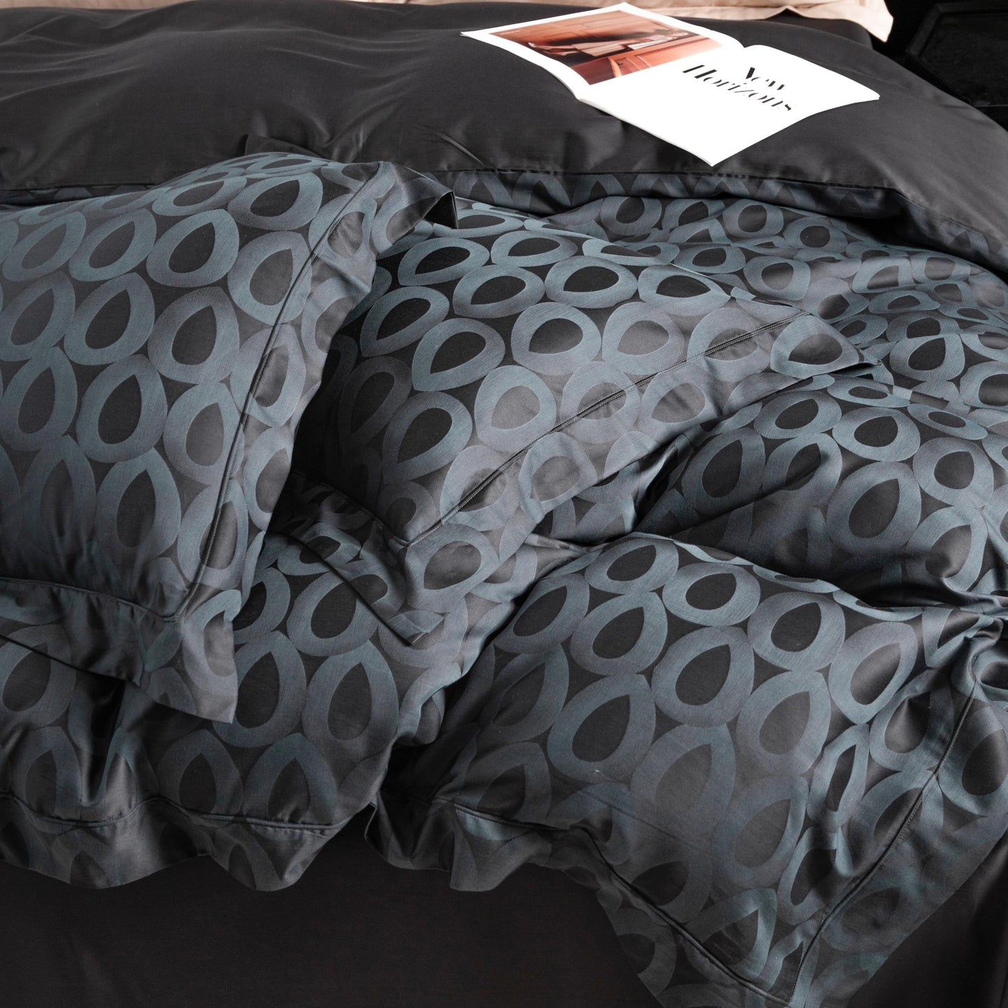 Modern geometric pattern sateen bedding set in charcoal and slate grey with a silky smooth texture and breathable fabric.