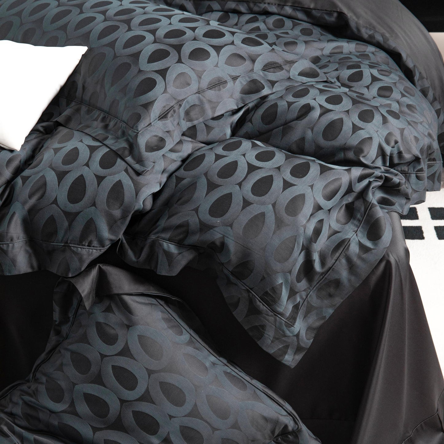 Luxurious Brooklyn sateen bedding set in black and grey with bold geometric pattern, silky smooth and breathable fabric.