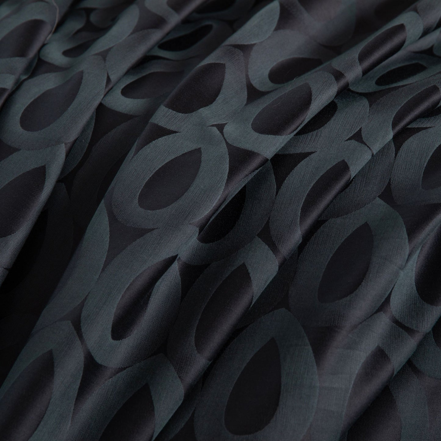 Close-up of Brooklyn modern geometric bedding in deep charcoal and slate grey with smooth, breathable Tencel cotton fabric.