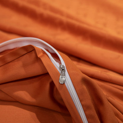 Close-up of a luxurious orange sateen bedding set zipper made from soft, breathable Tencel cotton fabric.