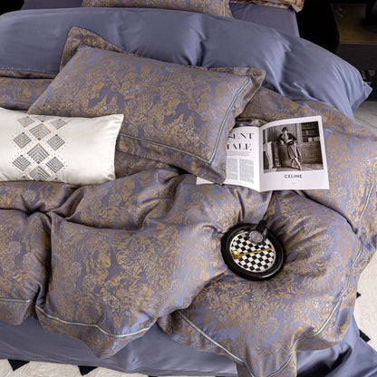 Luxurious Versailles sateen bedding set in soft blue and gold tones with intricate floral patterns and smooth Tencel cotton texture.