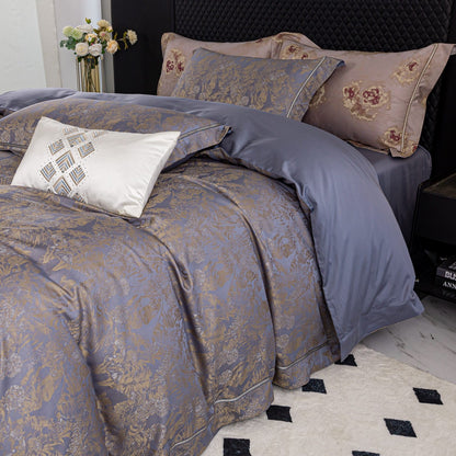 Luxurious Versailles sateen bedding set in muted tones with intricate patterns, featuring duvet cover, sheets, and pillowcases.
