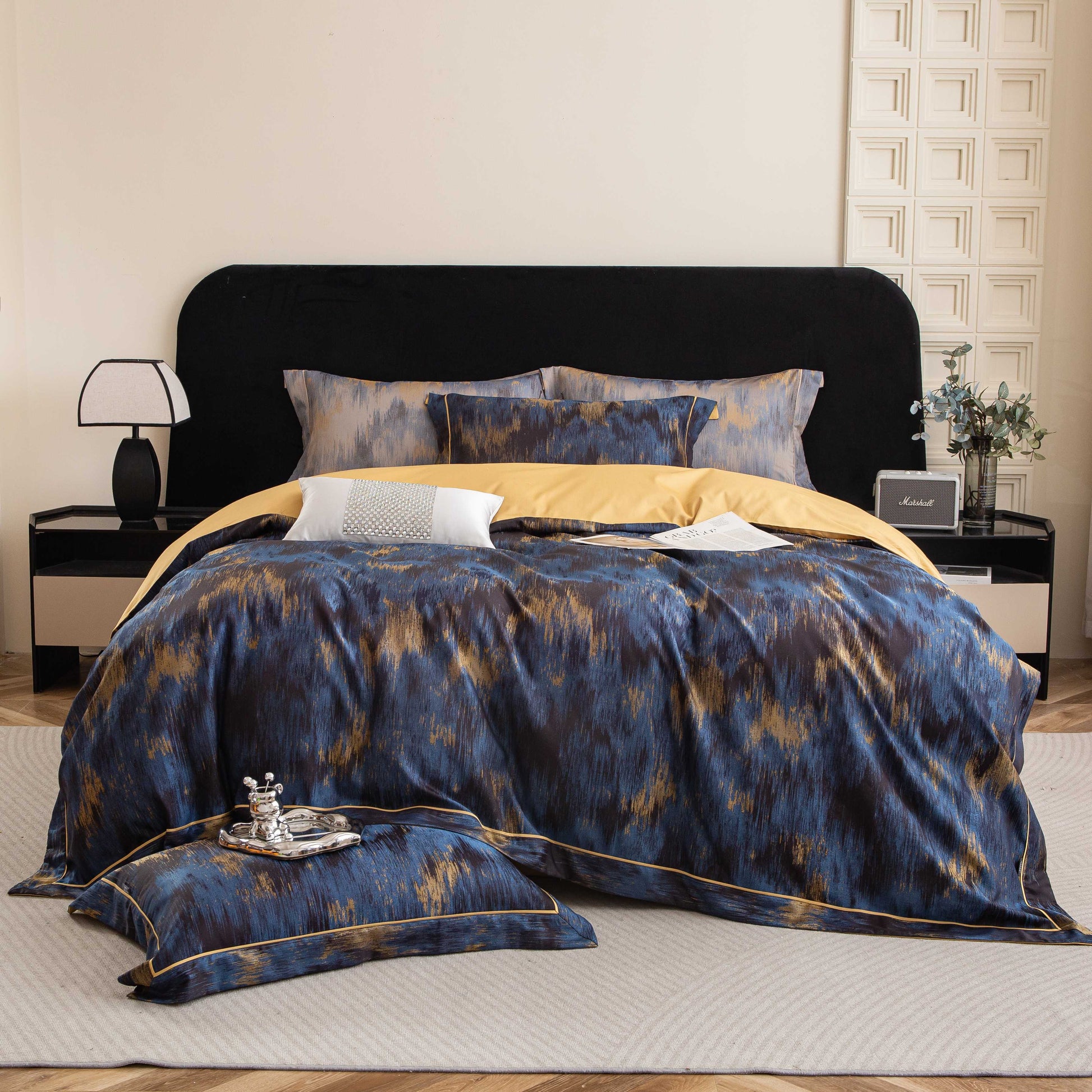 Luxurious Marrakech sateen bedding set in blue and gold tones, crafted from breathable, silky smooth Tencel cotton.