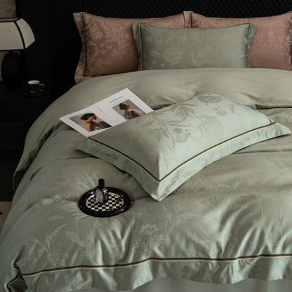 Luxury Avignon sateen bedding set in soft green with subtle floral patterns and contrasting piping detail