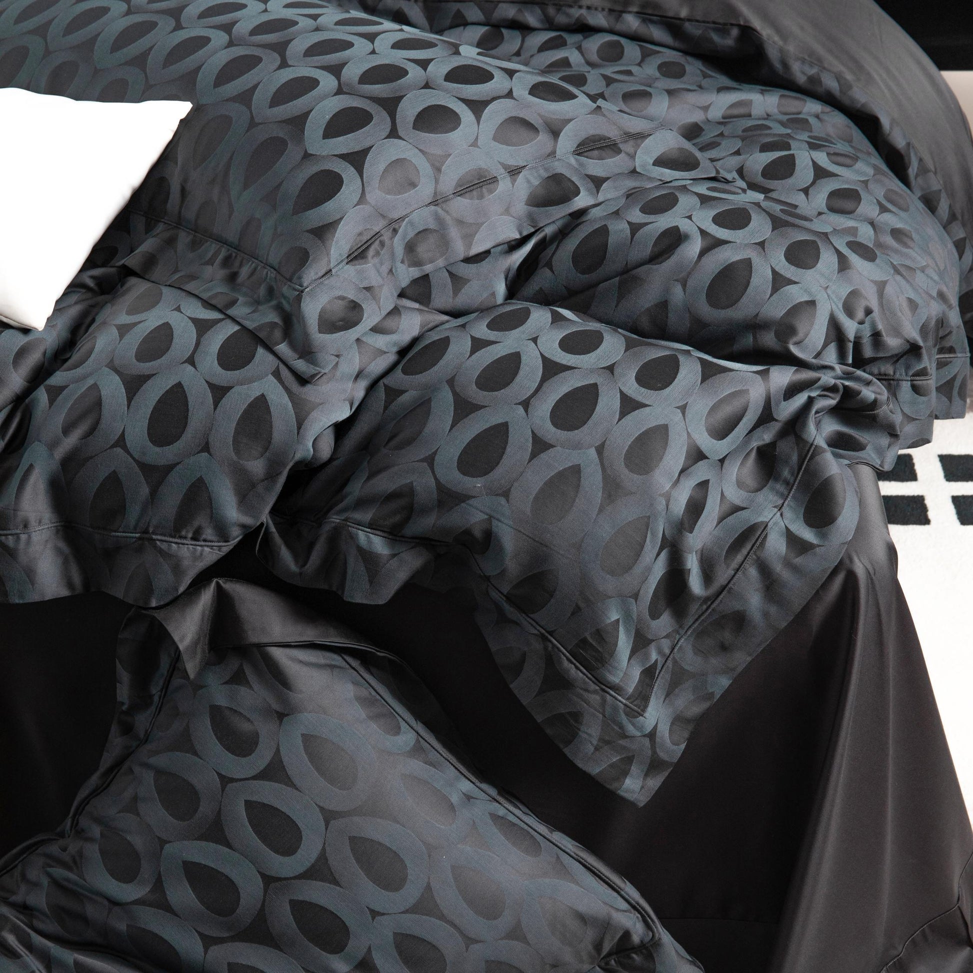 Luxurious Brooklyn sateen bedding set in black and grey with bold geometric pattern, silky smooth and breathable fabric.