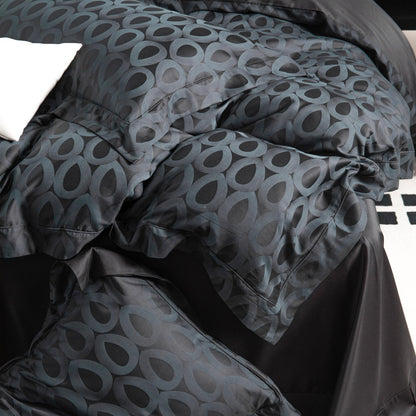 Luxurious Brooklyn sateen bedding set in black and grey with bold geometric pattern, silky smooth and breathable fabric.