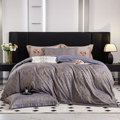 Luxurious Versailles sateen bedding set in elegant blue and gold tones on modern black upholstered bed.